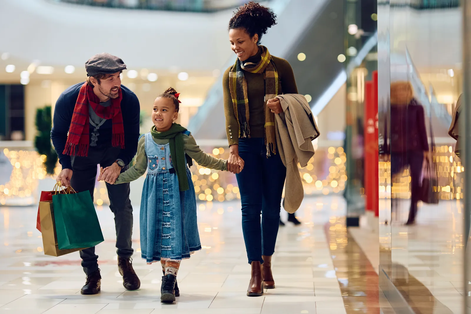 A family browsing the shops at Cameron Square Mall